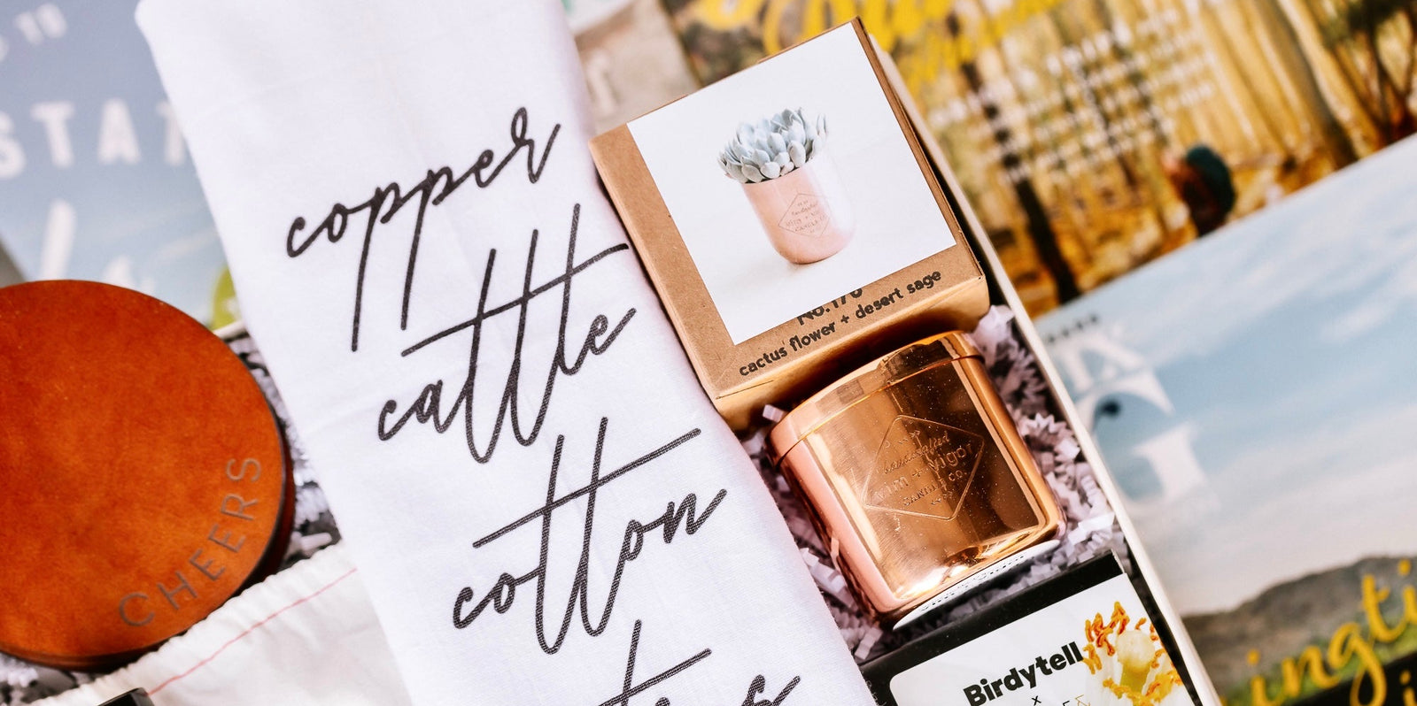Collection of scented candles with labels and a blurred background